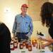 Dale Lesser of Lesser Farms and Orchard, chats with a shopper as she check out a honey bear during the MFarmers' Market set up outside of the Duderstadt Center on Thursday. Melanie Maxwell I AnnArbor.com